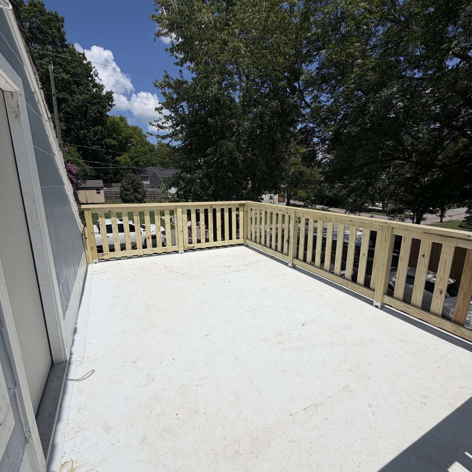 Outdoor deck with a white railing