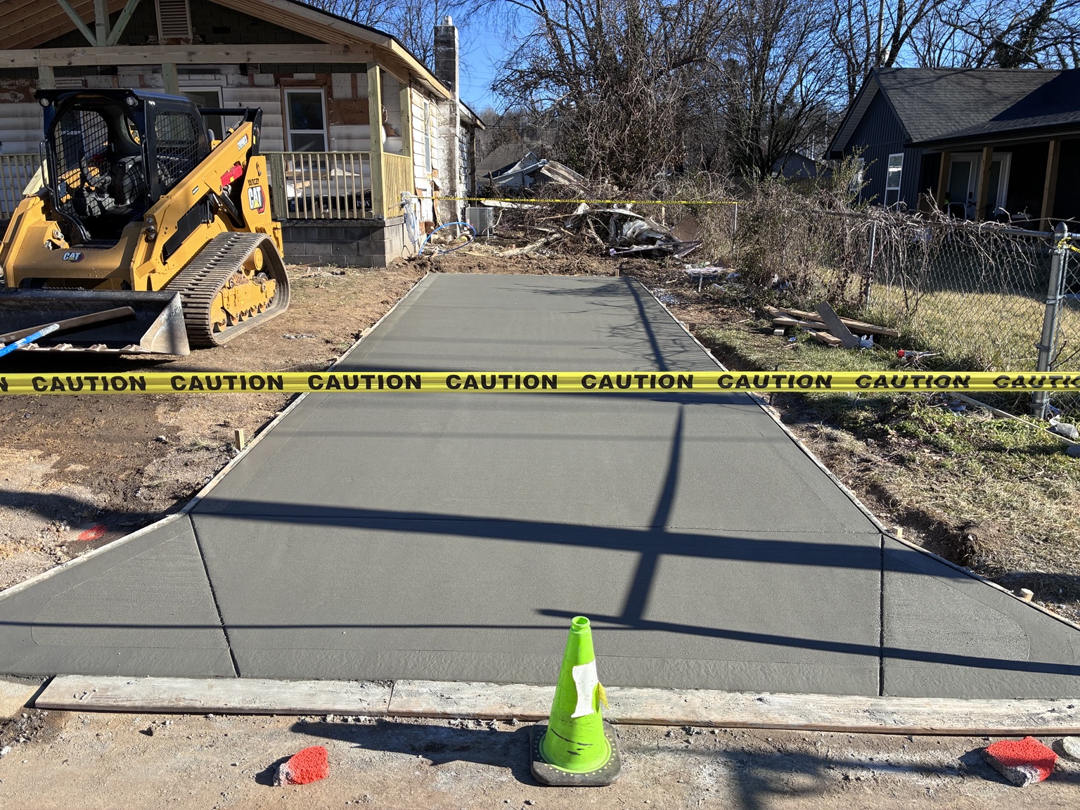 Newly finished concrete driveway with control joints